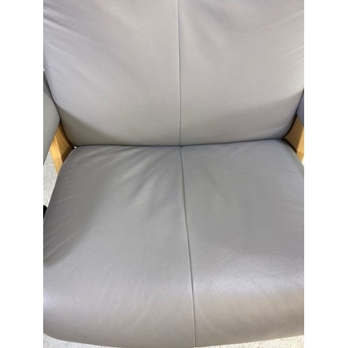 354 - Grey leather 'Stressless' reclining swivel armchair with matching footstool