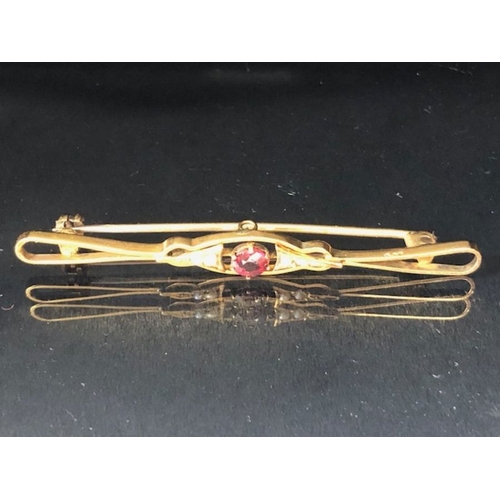 36 - 9ct Gold Garnet and seed pearl Brooch approx 5.5cm in length and 2.6g