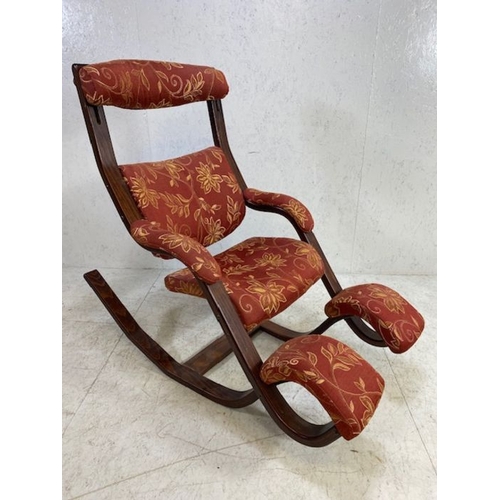 364 - Interesting upholstered rocking chair with foot rests and adjustable headrest