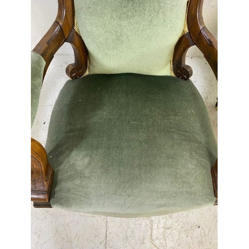 369 - His and Hers, Victorian upholstered button back armchairs, on original castors, with carved detailin... 