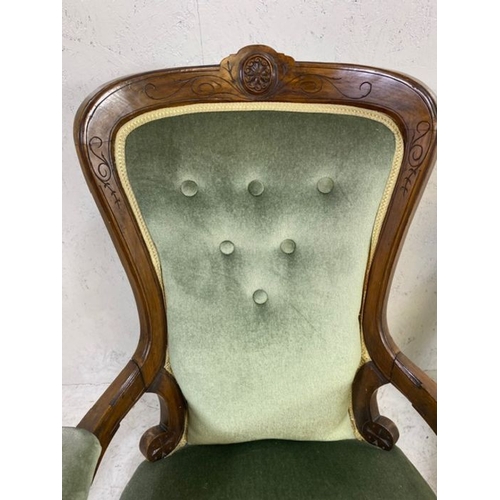 369 - His and Hers, Victorian upholstered button back armchairs, on original castors, with carved detailin... 