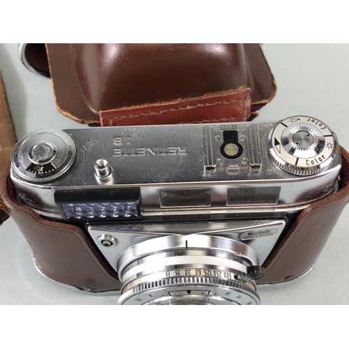 383 - Vintage Kodak Pronator 500LX 35mm Camera in its case, and a pair of opera glasses in their cases,