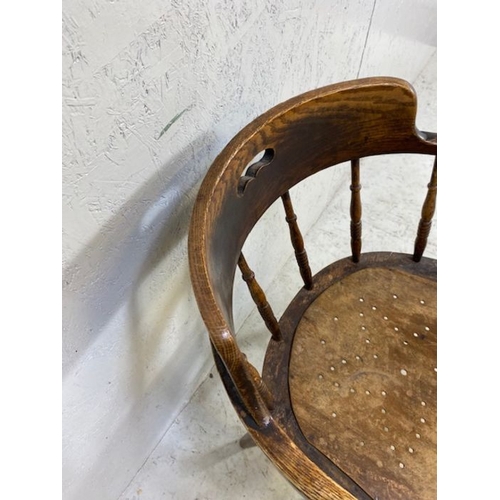 387 - Smokers or elbow chair with turned spindles and pierced seat