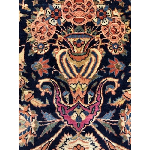 394 - Oriental Rug ,Indo Persian hand knotted silk rug with predominantly blue background with floral and ... 