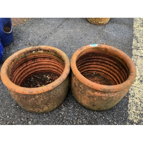 402 - Pair of circular terracotta garden pots approx 20cm tall