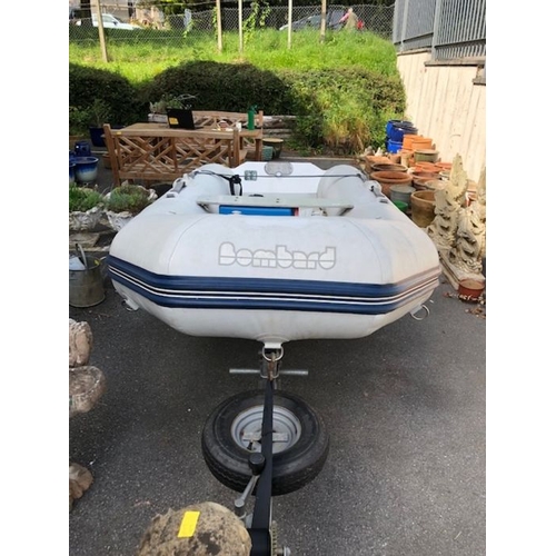 412 - Bombard Ridged Inflatable RIB boat model AX 5001 approx 10ft long on road trailer with winch and spa... 