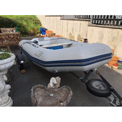 412 - Bombard Ridged Inflatable RIB boat model AX 5001 approx 10ft long on road trailer with winch and spa... 