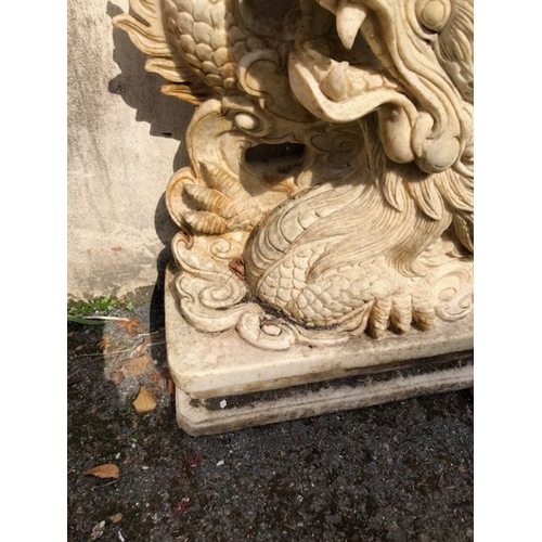 439 - Pair of Garden statues depicting Chinese dragons on Plinths made of resin approx 89 x 54cm