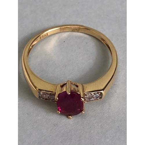 45 - 14ct Gold ring set with Oval faceted Ruby in claw setting with pair of diamonds to each shoulder siz... 