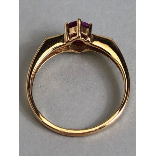 45 - 14ct Gold ring set with Oval faceted Ruby in claw setting with pair of diamonds to each shoulder siz... 