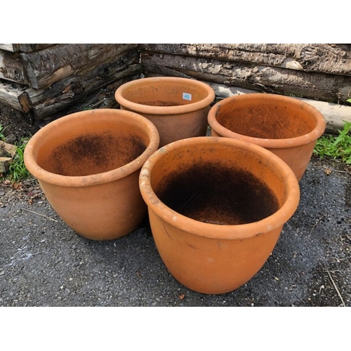 452 - Four matching circular Terracotta planters/pots each approx 28cm tall