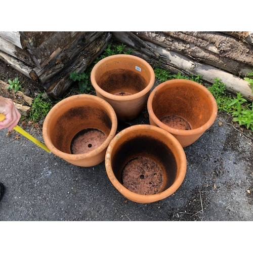 452 - Four matching circular Terracotta planters/pots each approx 28cm tall