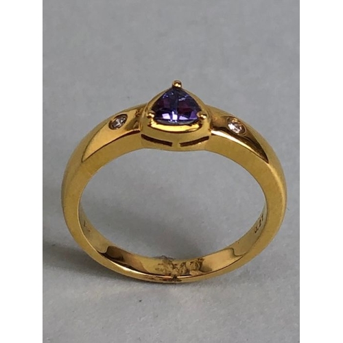 53 - 18ct Gold ring set with Triangular faceted Tanzanite stone with diamond shoulders size approx 'O' an... 