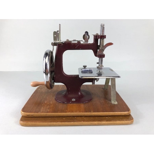 70 - Vintage toys,  1950s vintage child's sewing machine the Essex Mk1 inc sewing platform.