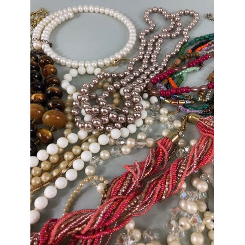 77 - Costume jewellery, quantity of vintage costume jewellery to include strings of Pearls,strings of bea... 