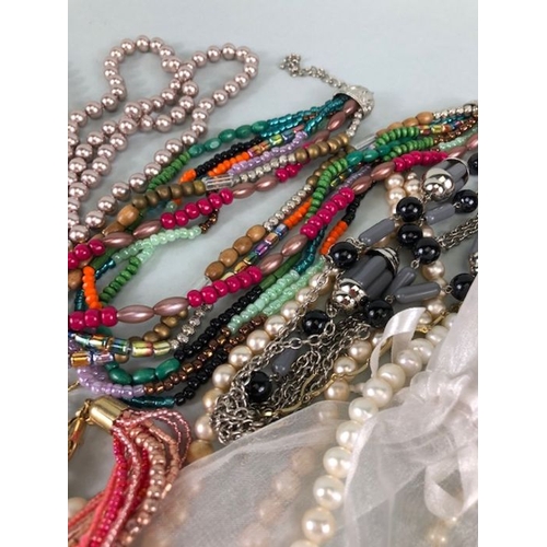 77 - Costume jewellery, quantity of vintage costume jewellery to include strings of Pearls,strings of bea... 