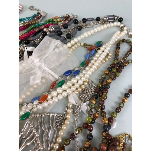 77 - Costume jewellery, quantity of vintage costume jewellery to include strings of Pearls,strings of bea... 