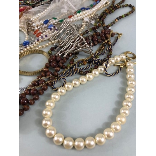 77 - Costume jewellery, quantity of vintage costume jewellery to include strings of Pearls,strings of bea... 