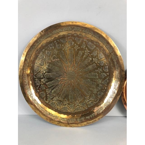 101 - Decorative Brass and copper plates , the brass plate of Islamic design approximately 34cm across, th... 