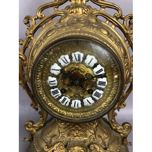 107A - Antique Clock, Louis style elaborately decorated brass cased mantel clock with Roman numeral dial, a... 