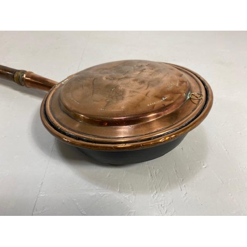 108 - Antique copper bed warming pan with  chased decoration to front, turned wooden spindle handle