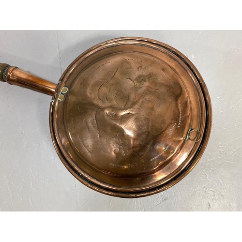 108 - Antique copper bed warming pan with  chased decoration to front, turned wooden spindle handle