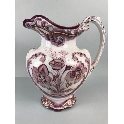 123 - Decorative China, large Victorian water jug decorated with magenta flowers  on a white background an... 