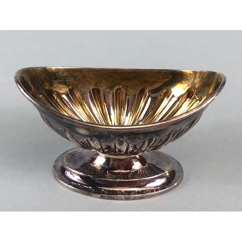 13 - Two hallmarked silver salts one on a pedestal base with gold gilt interior the other on a flat base ... 