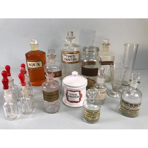 149A - Apothecary Chemist, quantity of vintage glass chemist bottles and jars some with labels, 18 items in... 