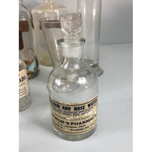 149A - Apothecary Chemist, quantity of vintage glass chemist bottles and jars some with labels, 18 items in... 