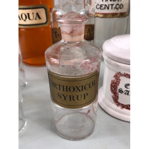 149A - Apothecary Chemist, quantity of vintage glass chemist bottles and jars some with labels, 18 items in... 