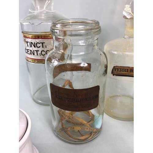 149A - Apothecary Chemist, quantity of vintage glass chemist bottles and jars some with labels, 18 items in... 