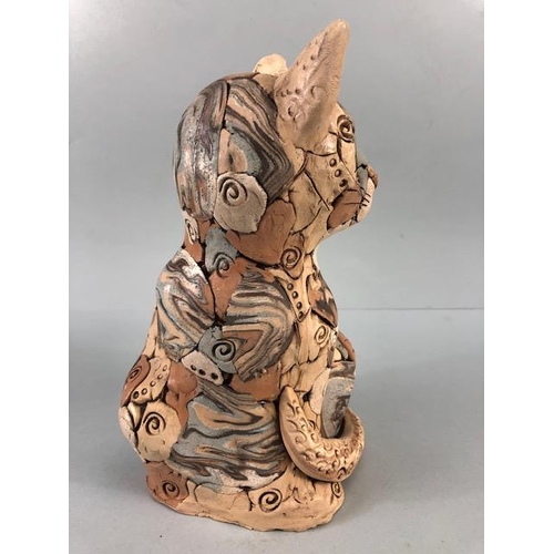 152 - Studio Pottery, multi colour jigsaw pottery figure of a content cat with a fish, matt glaze finish a... 