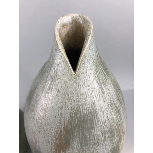 157 - Studio pottery, Art ceramics, Three stoneware vases of organic form with matching Viridian green mat... 