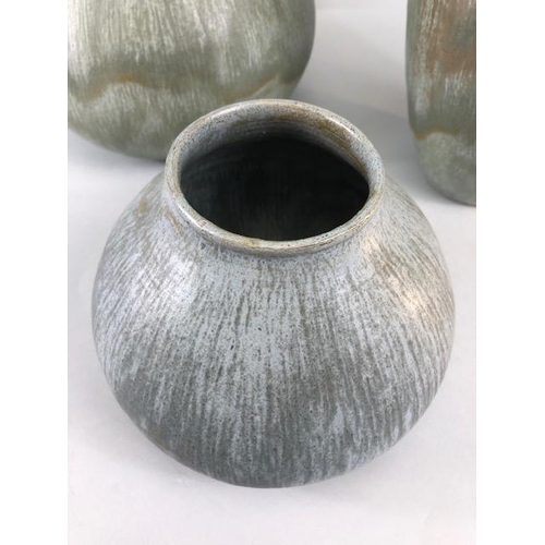 157 - Studio pottery, Art ceramics, Three stoneware vases of organic form with matching Viridian green mat... 