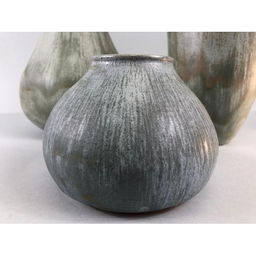 157 - Studio pottery, Art ceramics, Three stoneware vases of organic form with matching Viridian green mat... 