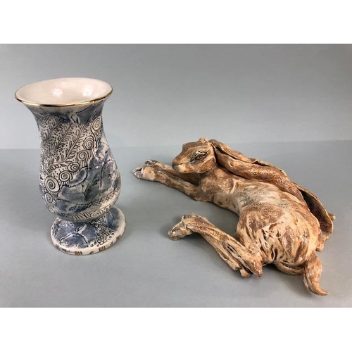 159 - Art pottery , pleasing study of a recumbent hare with incised decoration ang gilt highlights, approx... 