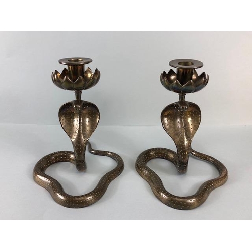 165A - Candle sticks, pair of Indian brass candlesticks fashioned as hooded Cobras the candle holders as li... 