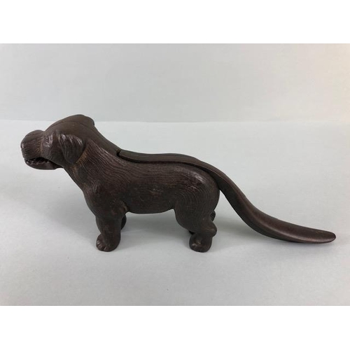 167A - Antique cast Iron dog nut cracker, the tail leaver stamped Made in England along with an illegible r... 