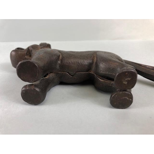 167A - Antique cast Iron dog nut cracker, the tail leaver stamped Made in England along with an illegible r... 