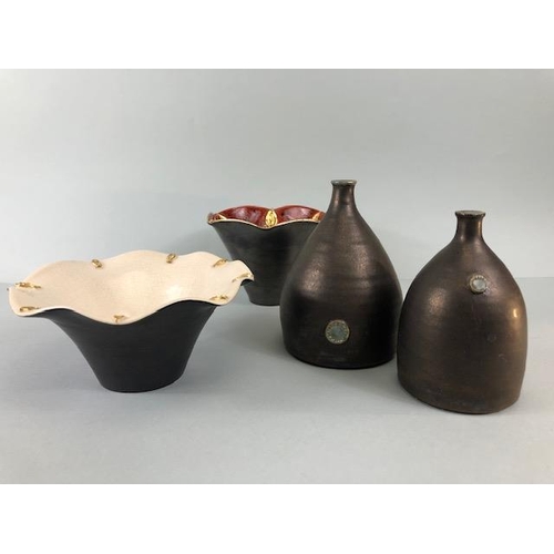 172 - Art pottery, ceramics, a collection of modern designed an decorated ceramics to include a cylinder v... 