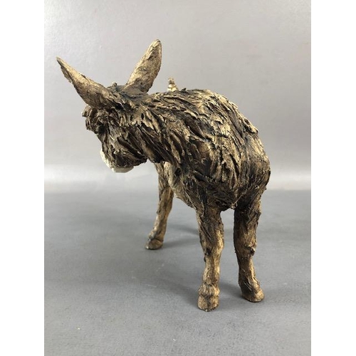 175 - Studio, Art Pottery, rough finish un glazed pottery study of a donkey  with a bird perched on its hi... 