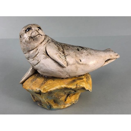 181 - Studio Art pottery, study of a seal pup on a rock signed D.C 2017 No2 to edge of base  approximately... 