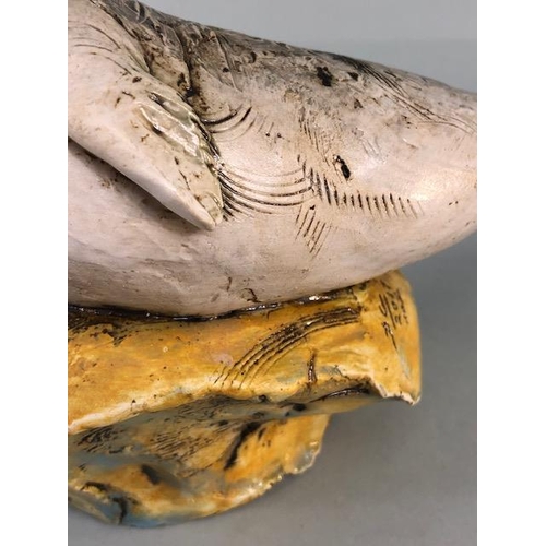 181 - Studio Art pottery, study of a seal pup on a rock signed D.C 2017 No2 to edge of base  approximately... 