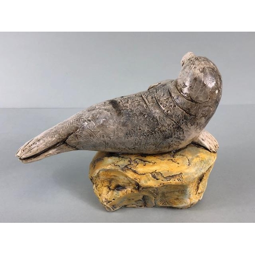 181 - Studio Art pottery, study of a seal pup on a rock signed D.C 2017 No2 to edge of base  approximately... 