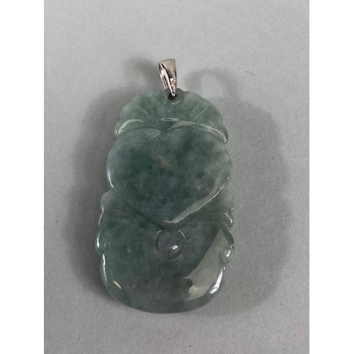 21 - Chinese Jewellery, green stone pendant carved with a mythical Fuzhu, approximately 4cm, a mutton fat... 