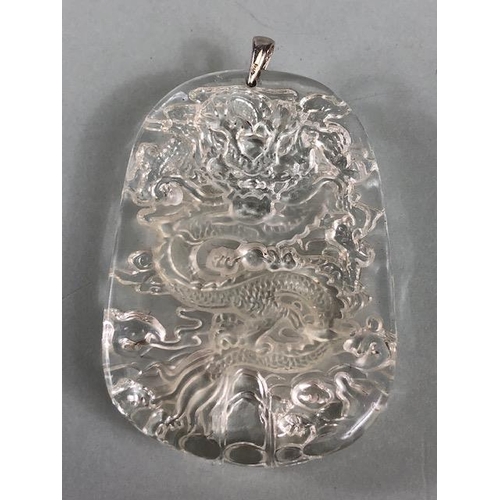 21 - Chinese Jewellery, green stone pendant carved with a mythical Fuzhu, approximately 4cm, a mutton fat... 