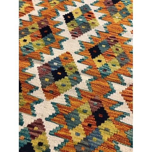 223 - Oriental Rug, Wool hand Knotted Chobi Kilim Runner, colourful geometric designs , approximately 200 ... 