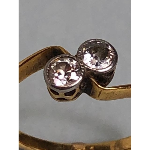 22A - Antique 18ct yellow gold ring mounted with 2 diamonds in a cross over design, approximately K 1/2 an... 