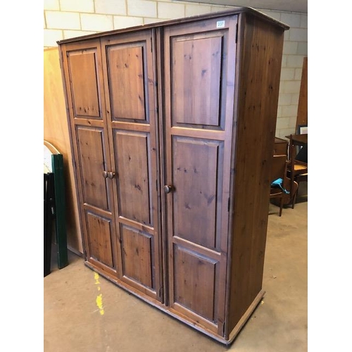 237 - Pine furniture, dark stained pine triple wardrobe, double door section for hanging clothes and singl... 